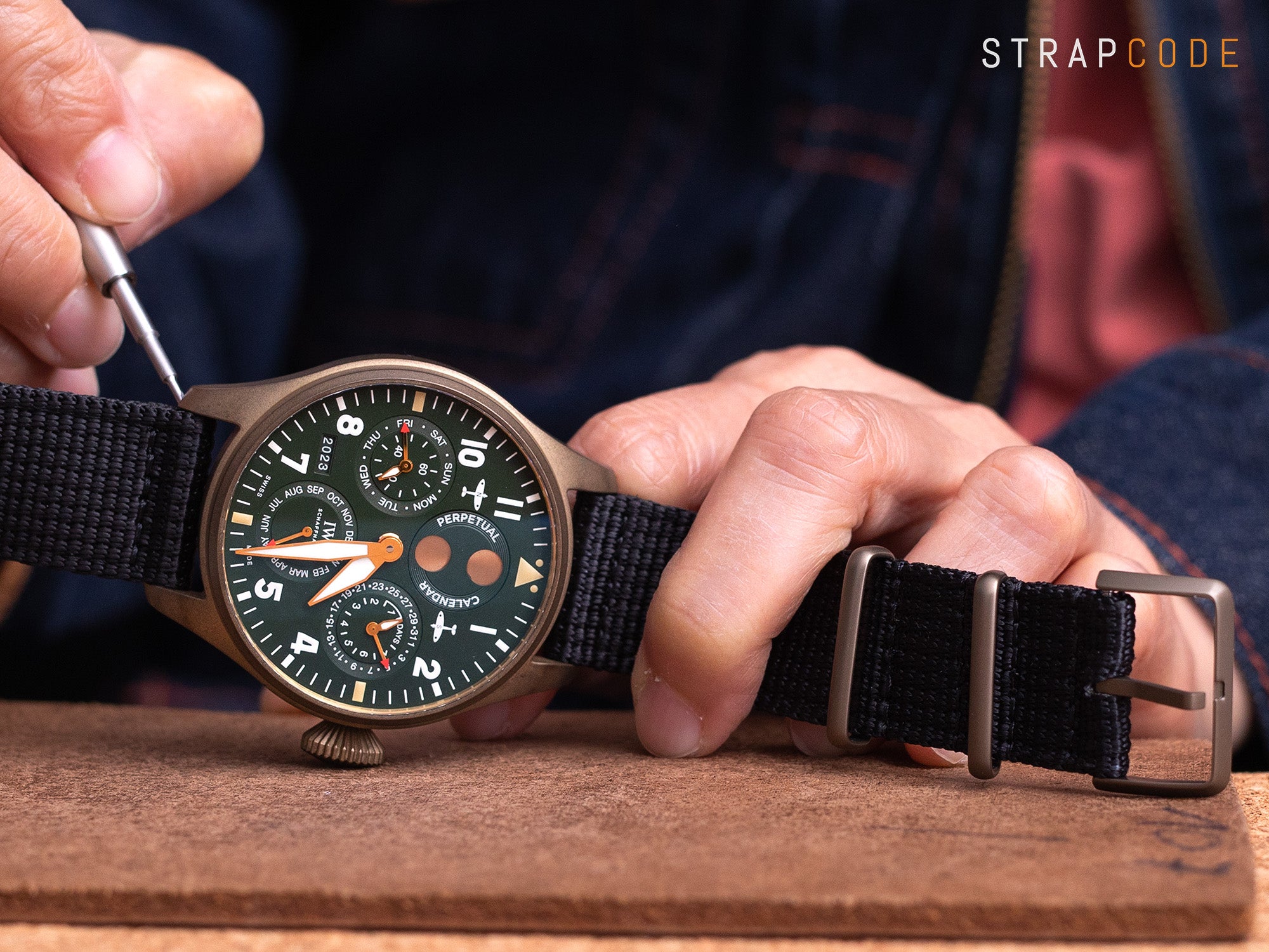 Black nylon strap sewn with retro bronze keepers and buckle and IWC Big Pilot's Perpetual Calendar Spitfire IW503601 bronze watch by Strapcode watch bands