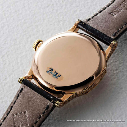 Yellow-gold wristwatch replete with hunter back and hand-engraved lugs