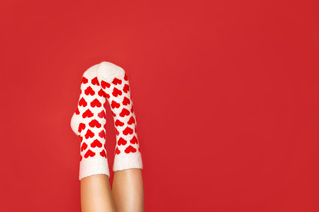 Girls wearing red and white valentines day socks
