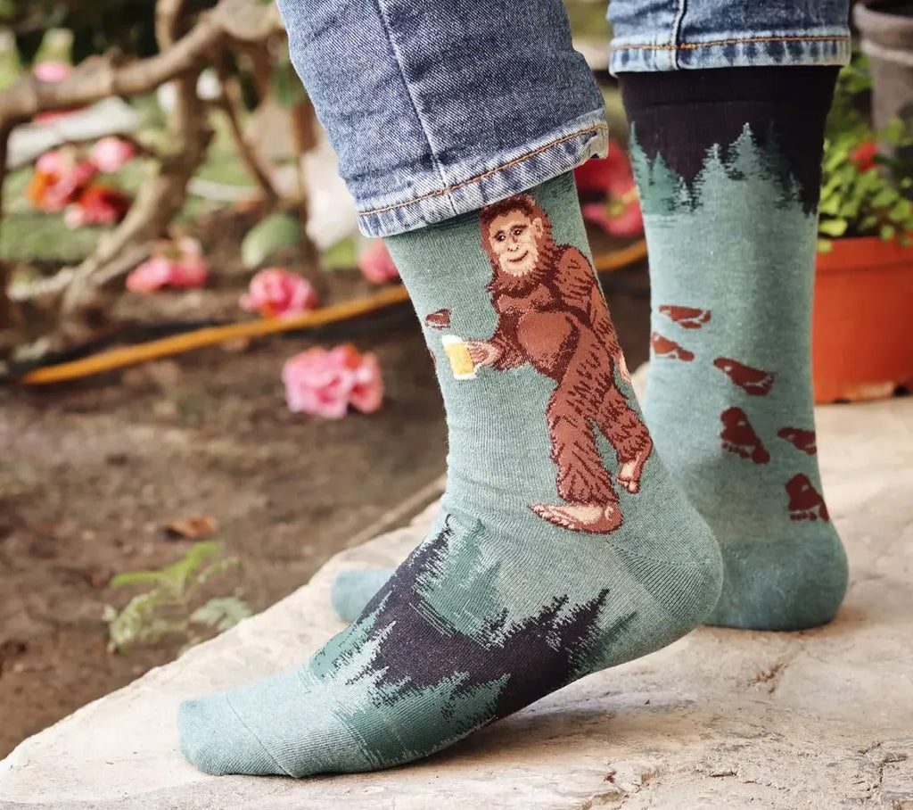 funny socks featuring big foot holding a beer