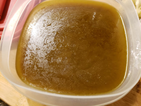 Cannabutter poured in Tupperware container