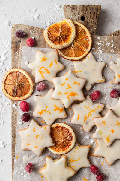 cranberry orange shortbread cookies in star shape with link to recipe