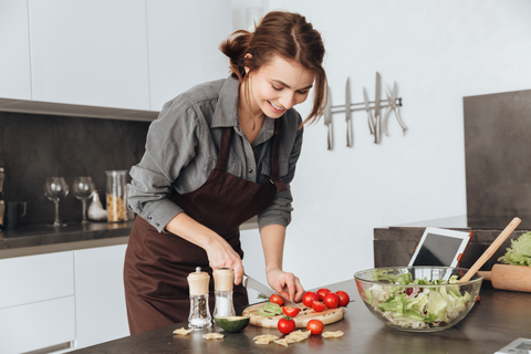 Women in Kitchen preparing Food