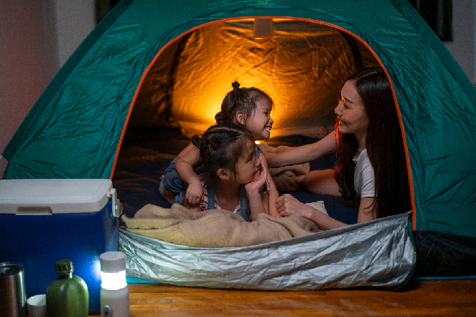 Family in green tent
