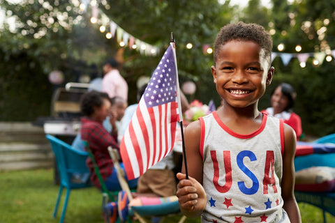 Child holding US Flag