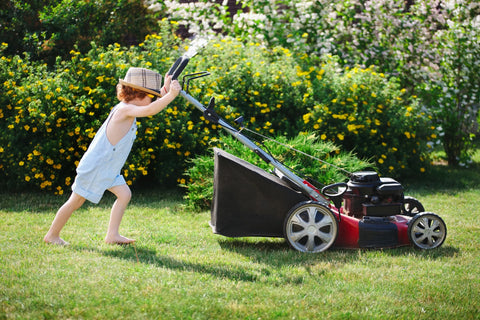 Child mowing lawn