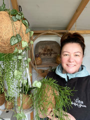 Stephanie in the Artful Green Potting shed amongst her plants