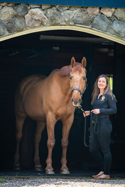 Stephanie Kokenos of Amberfield Farm and Andre, wearing the smart halter