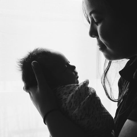 a newborn with mom