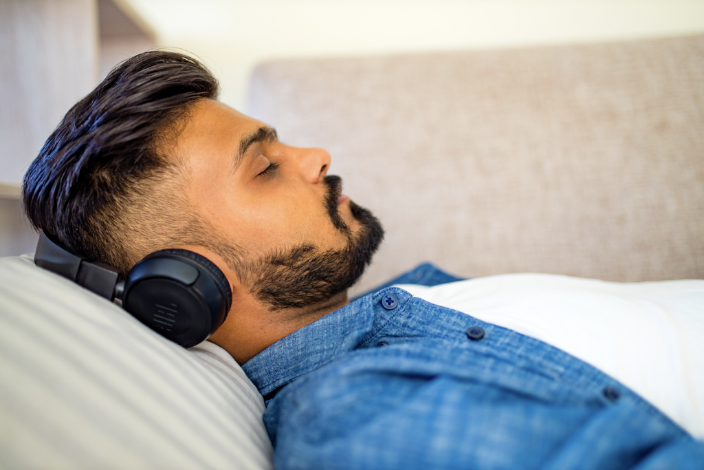 Man listening to music with his eyes closed