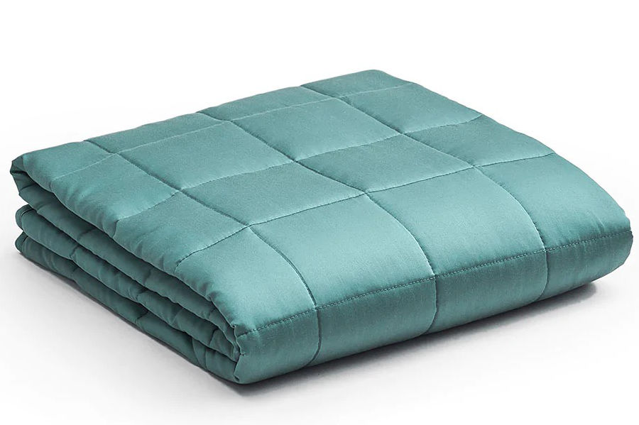 A neatly folded YNM Cooling Weighted Blanket in fresh mint color on a white background.