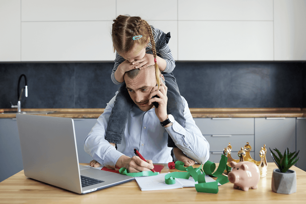 types of stress: dad trying to work while his kid is trying to get his attention