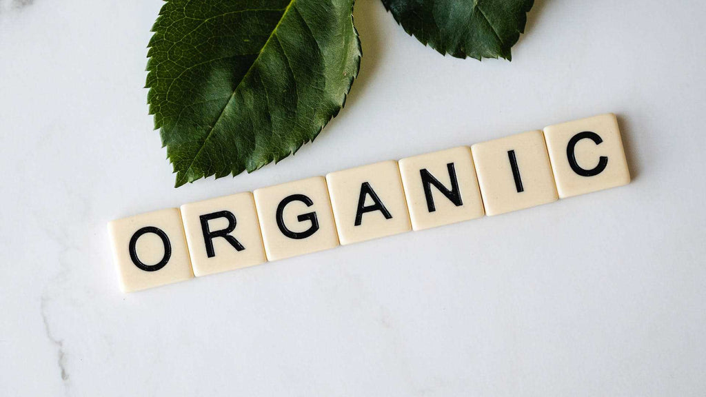 scrabble tiles with the word organic spelled out