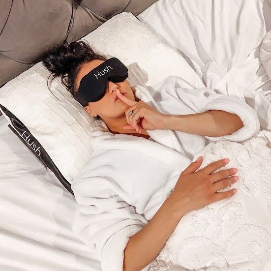 Woman wearing a Hush sleep mask