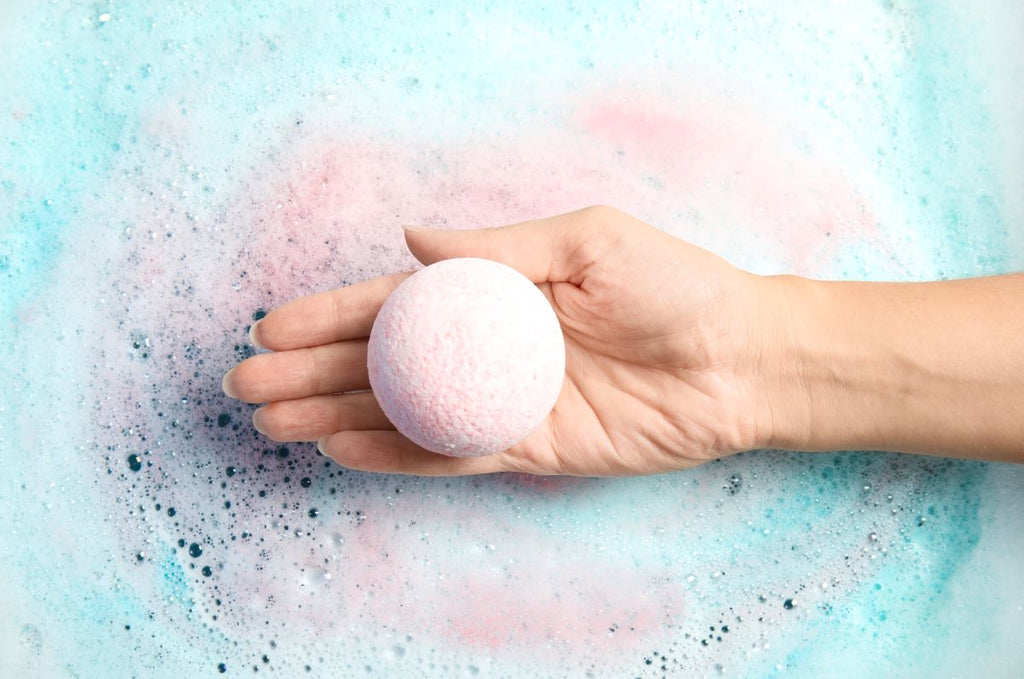 stress relief gifts: bath bomb in a woman's palm