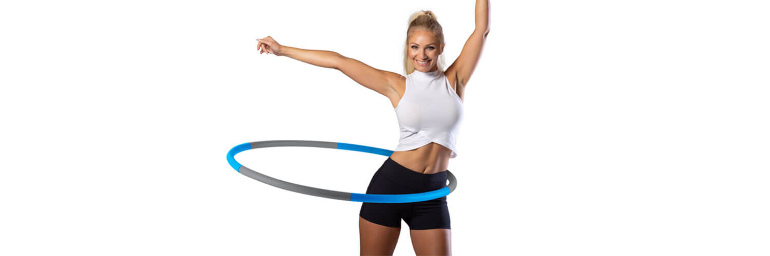 Woman using a weighted hula hoop for exercise