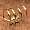 An artisan handmade extra wide, pure brass open striped cuff bracelet designed by OMishka.