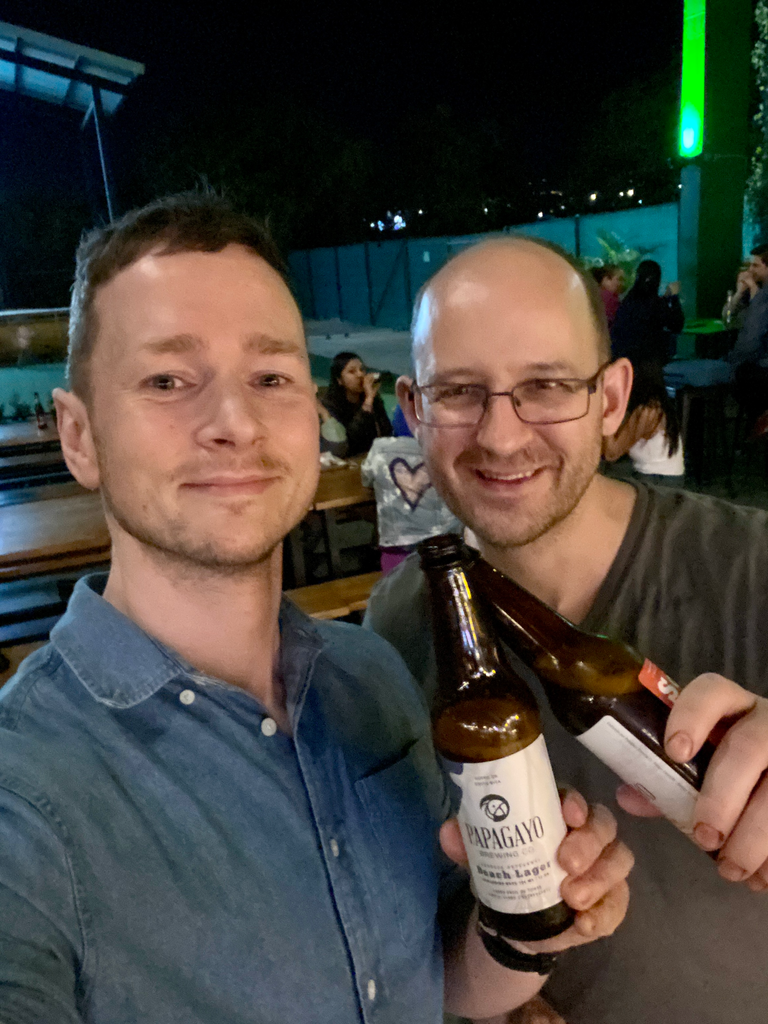 Hasbean eCommerce Manager Chris Glover-Price and OCR Green Buyer Roland Glew enjoy a refreshing beverage together at Mercado La Cartonera in Alajuela, Costa Rica ¡Salud!