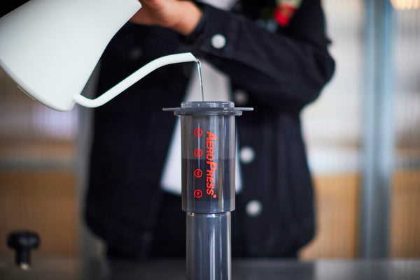 Pouring water into an inverted AeroPress brewer