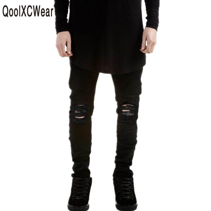 black ripped jeans designer