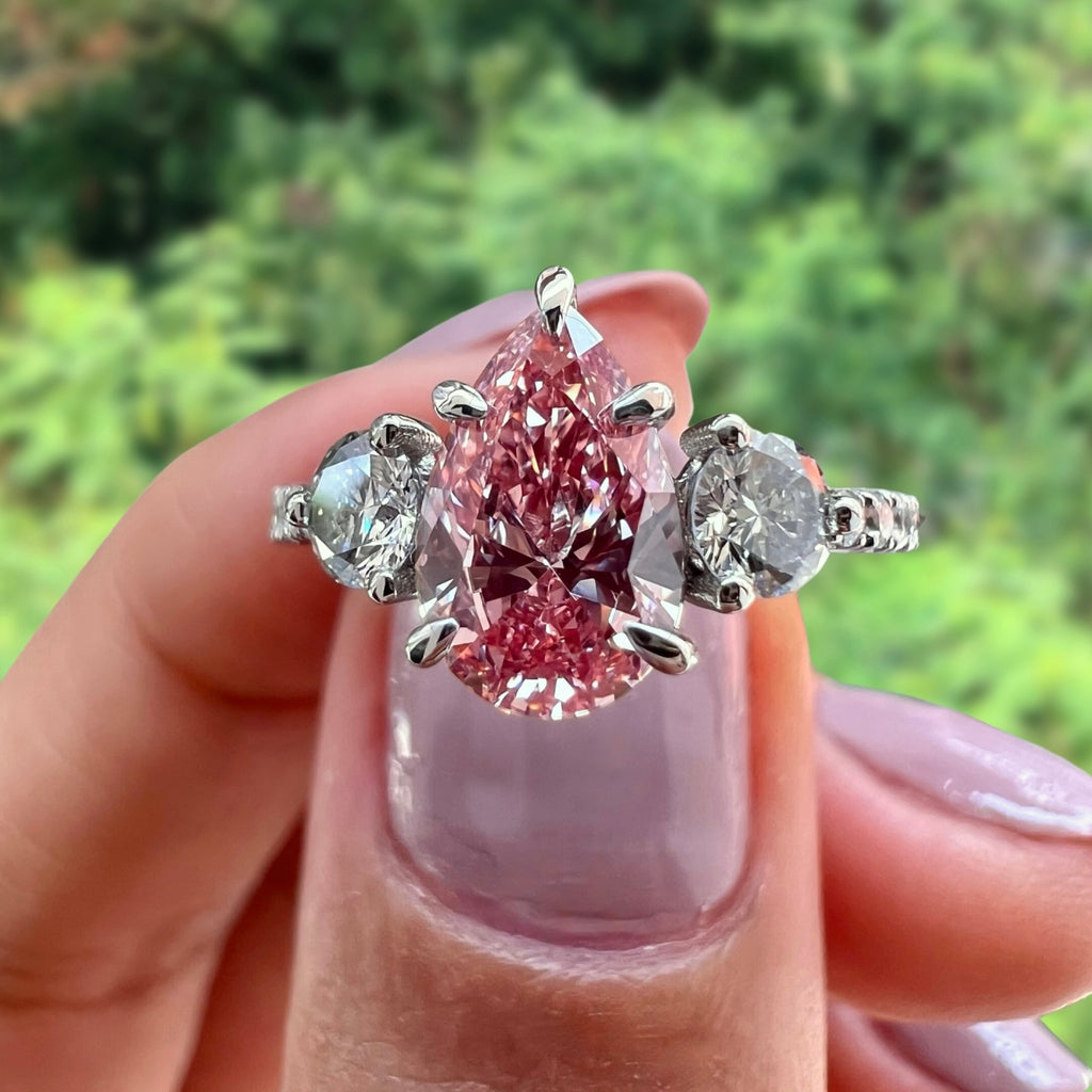 pink lab diamond three stone engagement ring