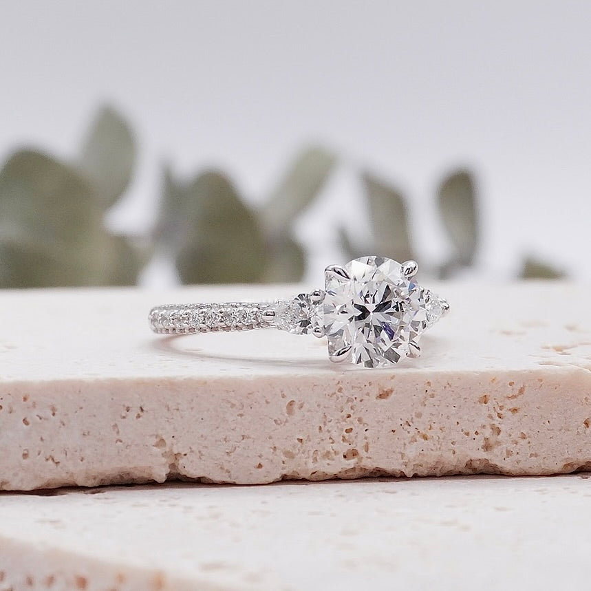 three stone trilogy diamond engagement ring