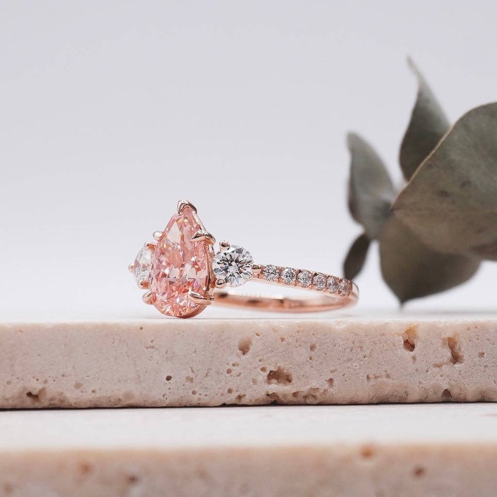 three stone pink diamond engagement ring
