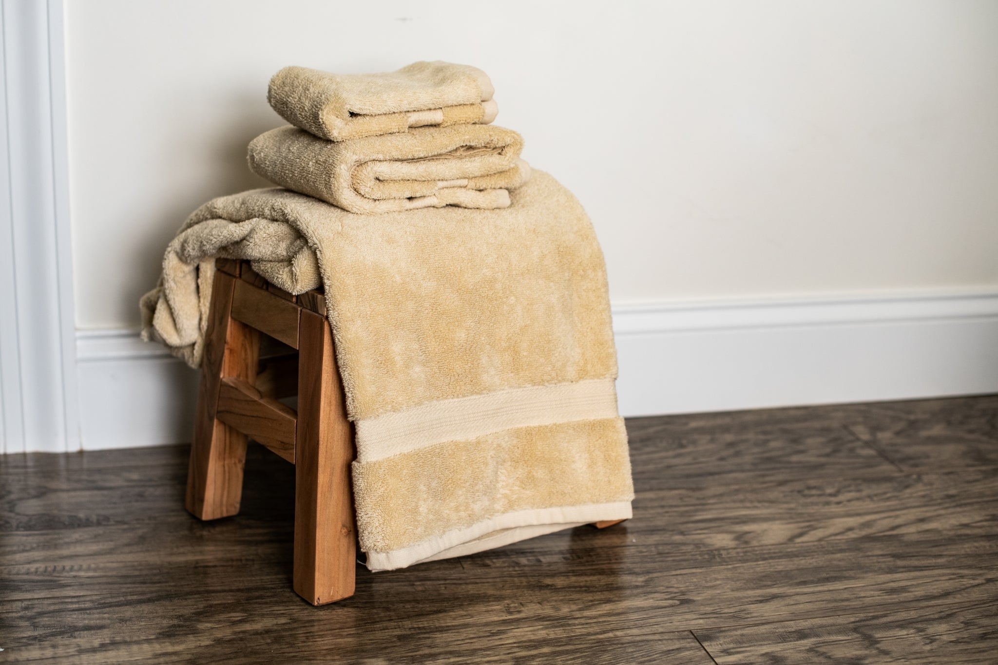 American Blossom Linens Towels on Stool