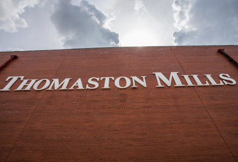 Thomaston Mills Sign on the side of the plant.