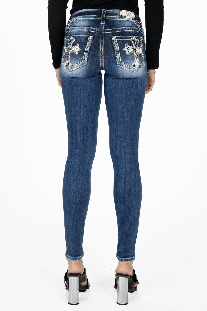 mild blue cow print cross skinny jeans