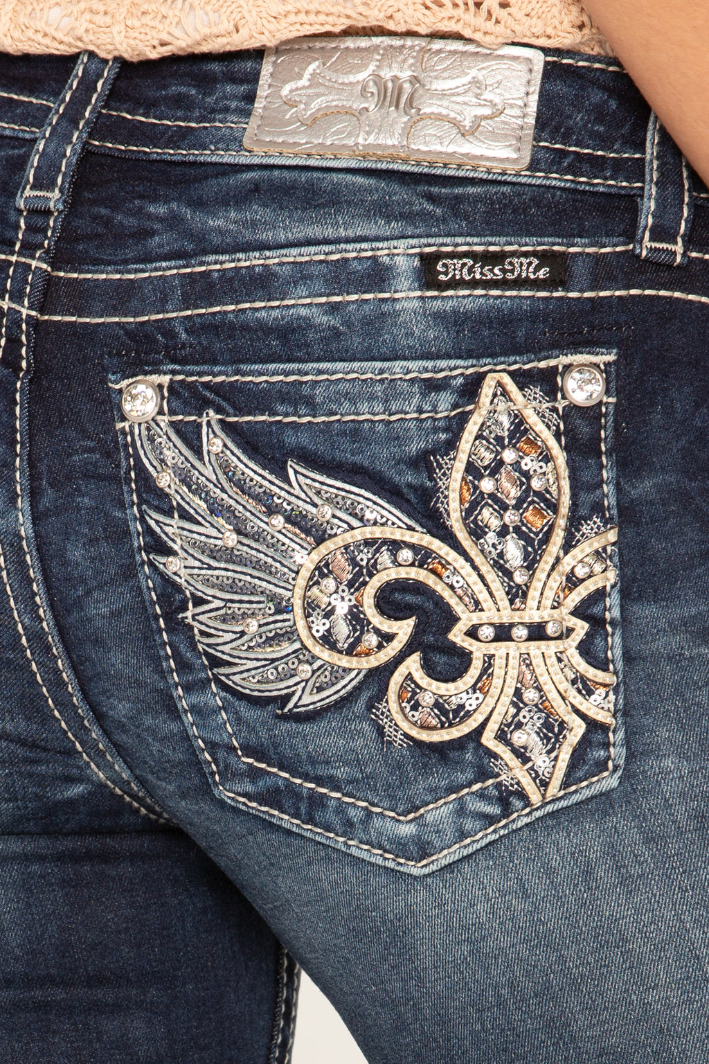 jeans with fleur de lis on pocket