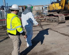 Demolition Crane Operator with supplied air respirator for asbestos abatement
