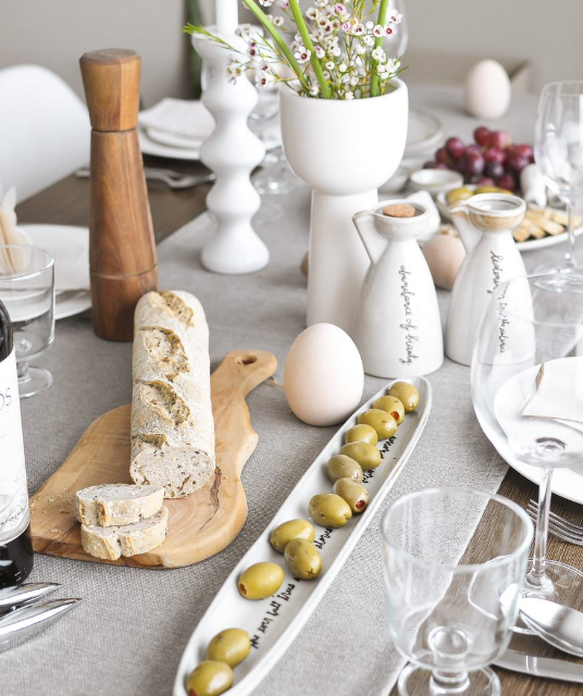 charcuterie plating with white vases