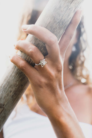 Blessed Be Magick - Silver Merkaba Ring worn by witchy model holding tree trunk