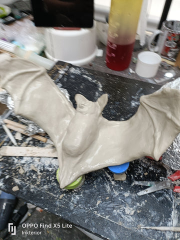 Clay bat sculpture