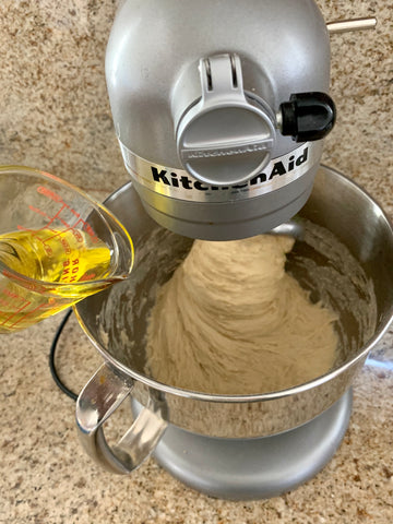 adding oil to the challah dough