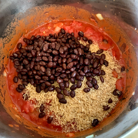 black beans, brown rice, broth, and crushed tomatoes in instant pot