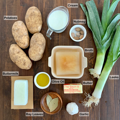 picture of ingredients for potato leek soup on a wooden table