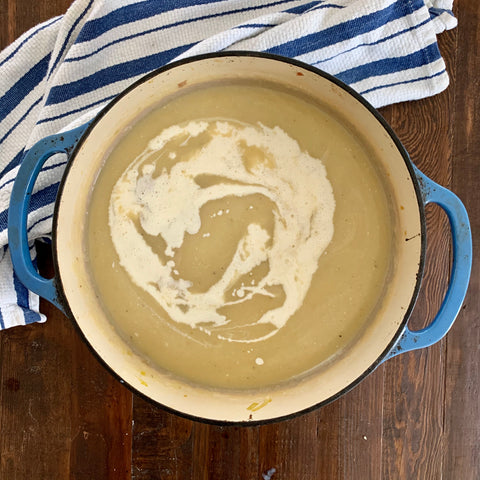 pot of potato leek soup with heavy cream