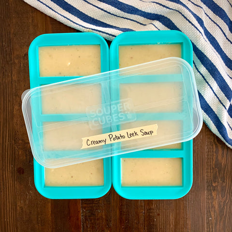 2 1-cup souper cubes trays filled with creamy potato leek soup