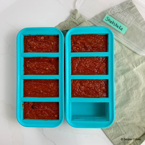 2 1-cup souper cubes trays filled with shakshuka sauce