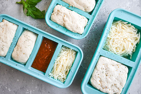 Pizza kits assembled in Souper Cubes trays landscape.