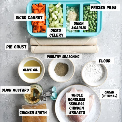 Chicken pot pie ingredients displayed in Souper Cubes and on a kitchen table. 