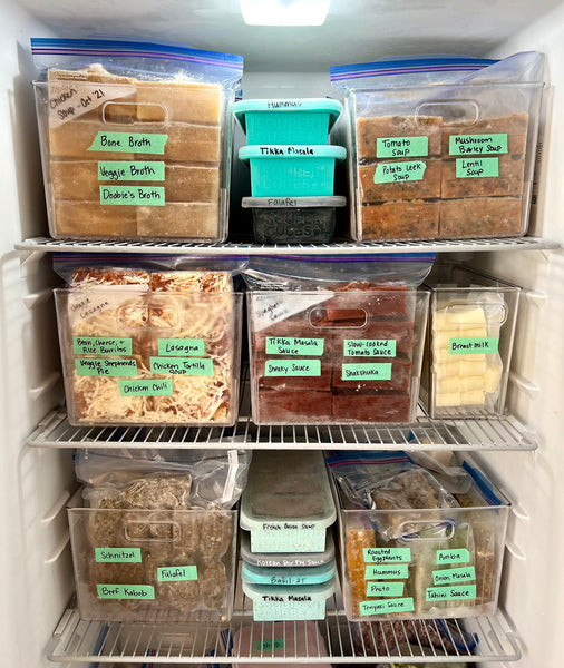 image of an upright freezer with frozen souper cubes in bins