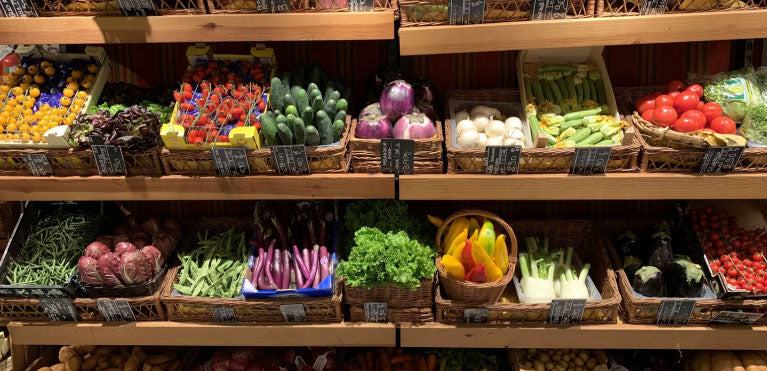 Multiple containers of fresh vegetables.