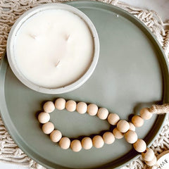 Baycreek & Co Feb 2023 Guest Vendor Nora Home Decor cement plate with wooden beads and candle