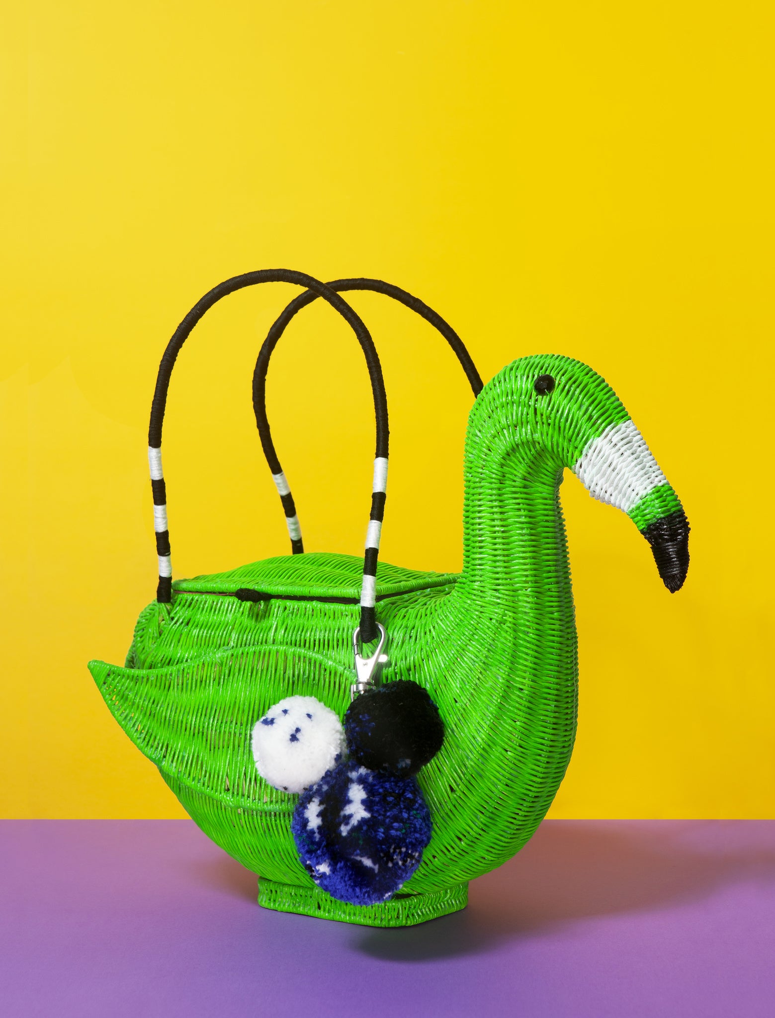 Green Wicker Darling DIY Flamingo Bag on a colourful background