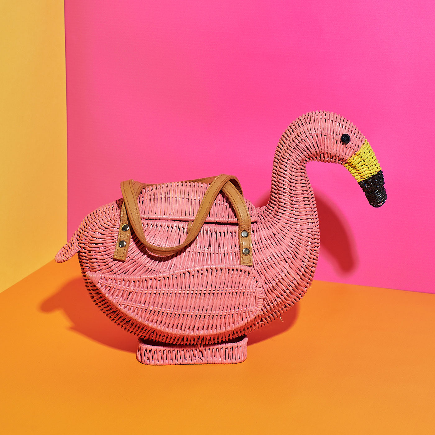 Wicker Darling's pink Chile the Flamingo on a colourful background