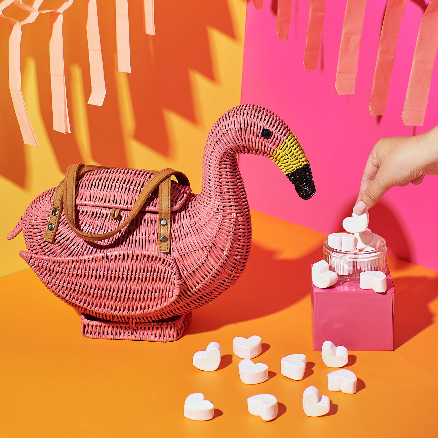 Chile the Flamingo Wicker Darling bag on a colourful background