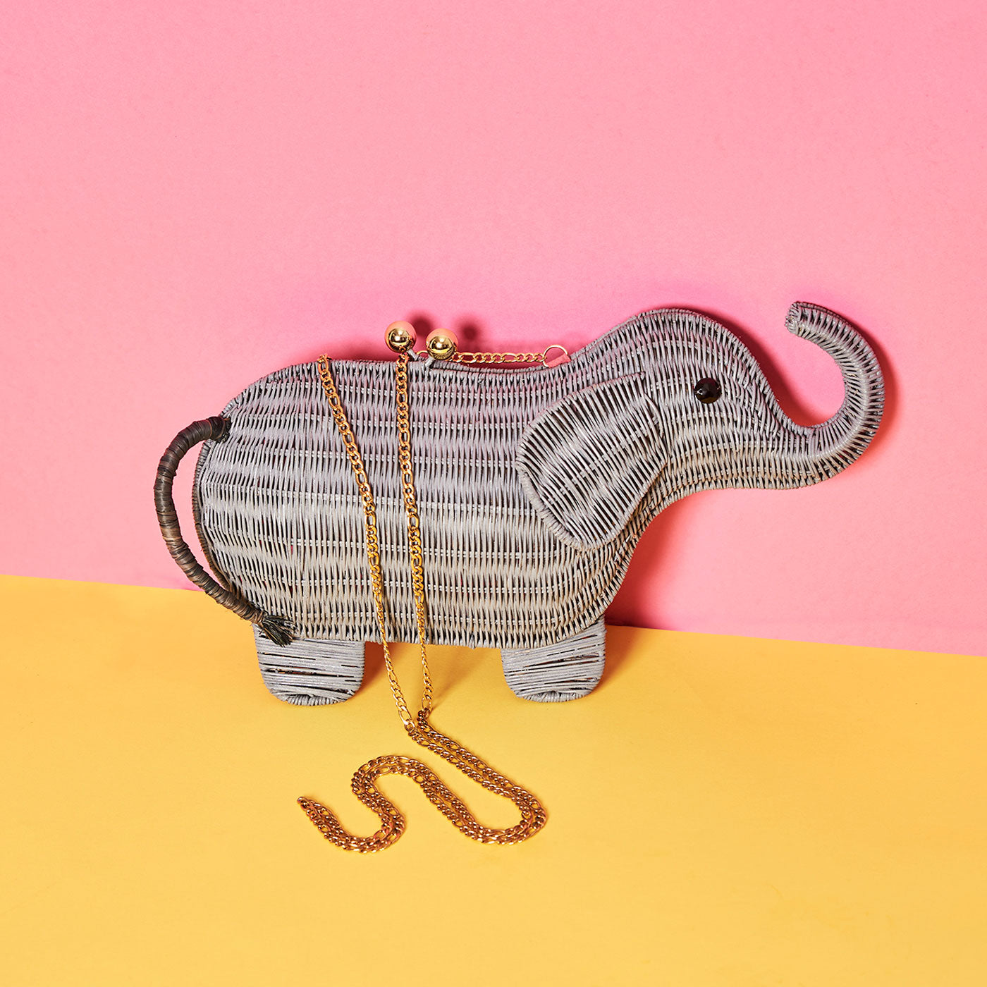 Wicker Darling's Nell-ephant the Elephant Clutch on a colourful background